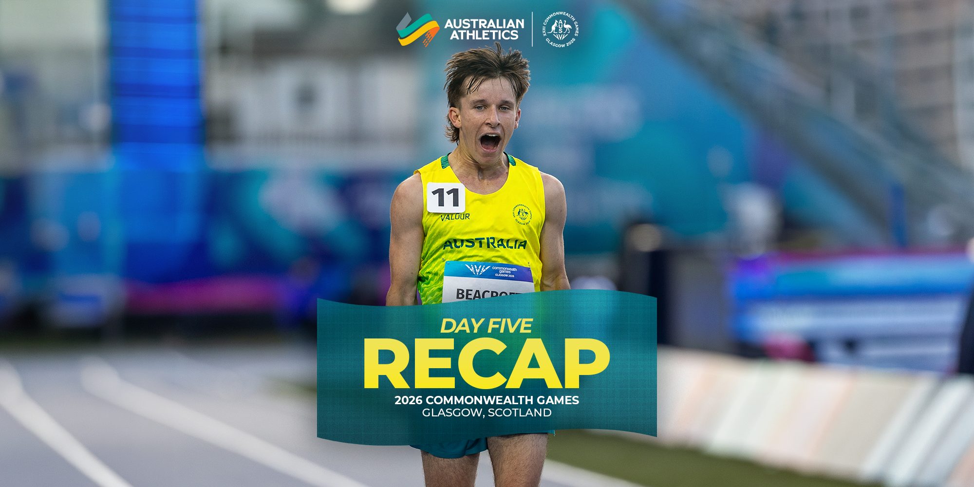 Australian athlete in yellow uniform crossing a finish banner at the 2026 Commonwealth Games Glasgow, excitedly celebrating a run; bib number 11 visible.